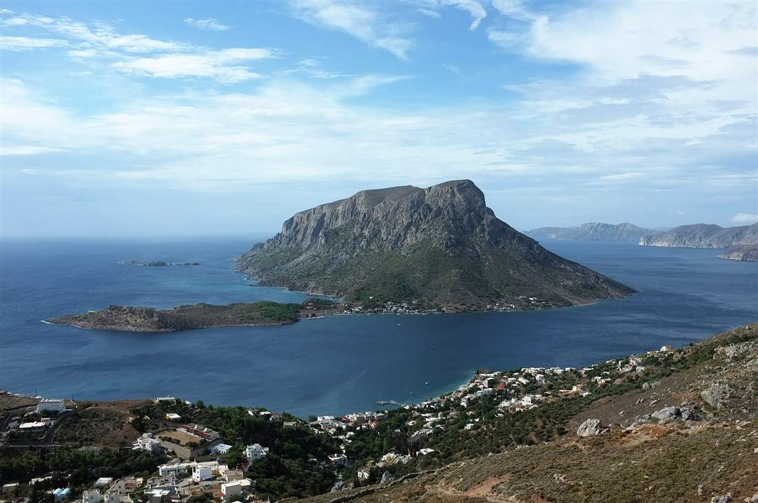 The dramatic pyramid islet of Telendos rising from the sea off Myrties on Kalymnos, reached on a Kalymnos yacht charter