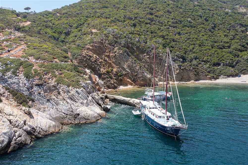 Two gulets anchored in the sheltered cove at Kyra Panagia on the east coast of Karpathos