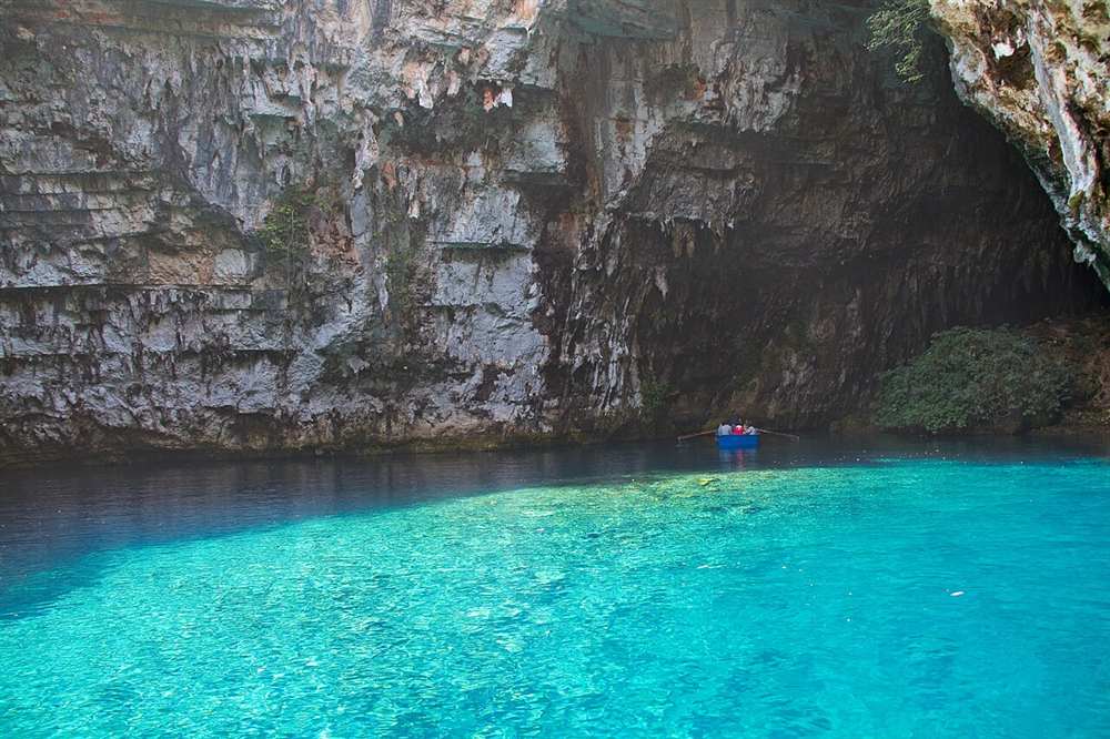 A rowing boat on the underground lake in Melissani cave, Kefalonia