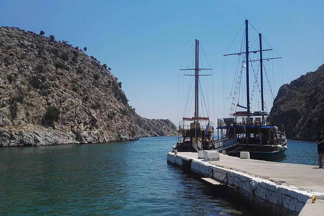 Excursion caiques tied up at the jetty on Kalymnos, a stop on the Kos three island cruise