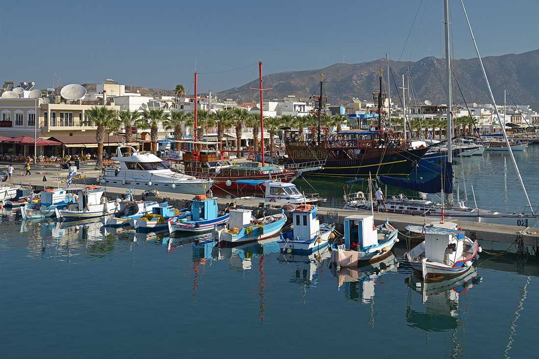 Small hire boats moored along the berth at Kardamena harbour on Kos