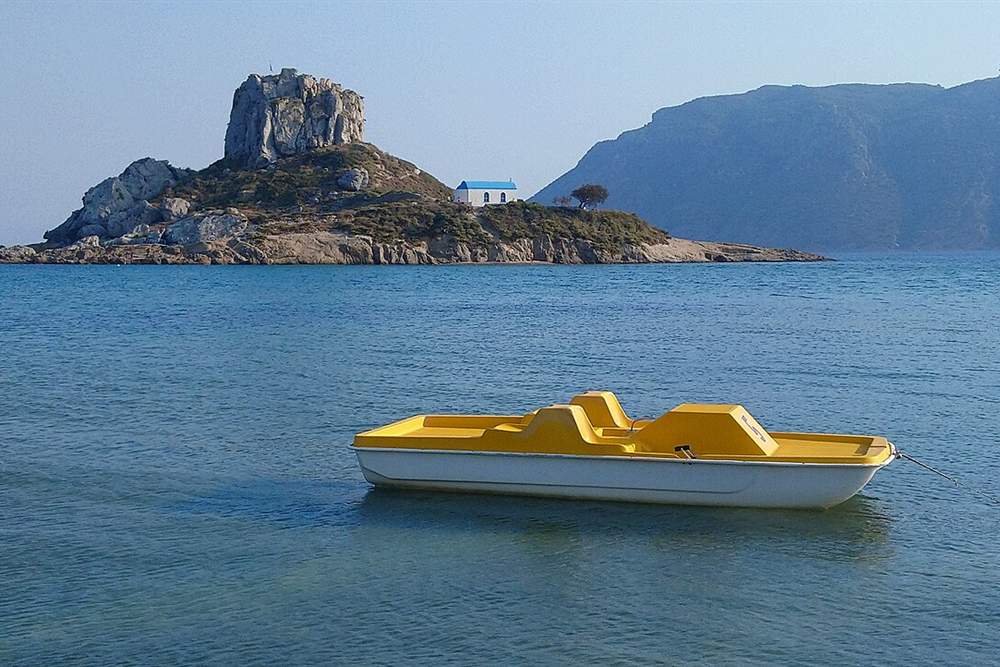 Kastri islet and its blue-domed chapel off Agios Stefanos in Kefalos bay, Kos