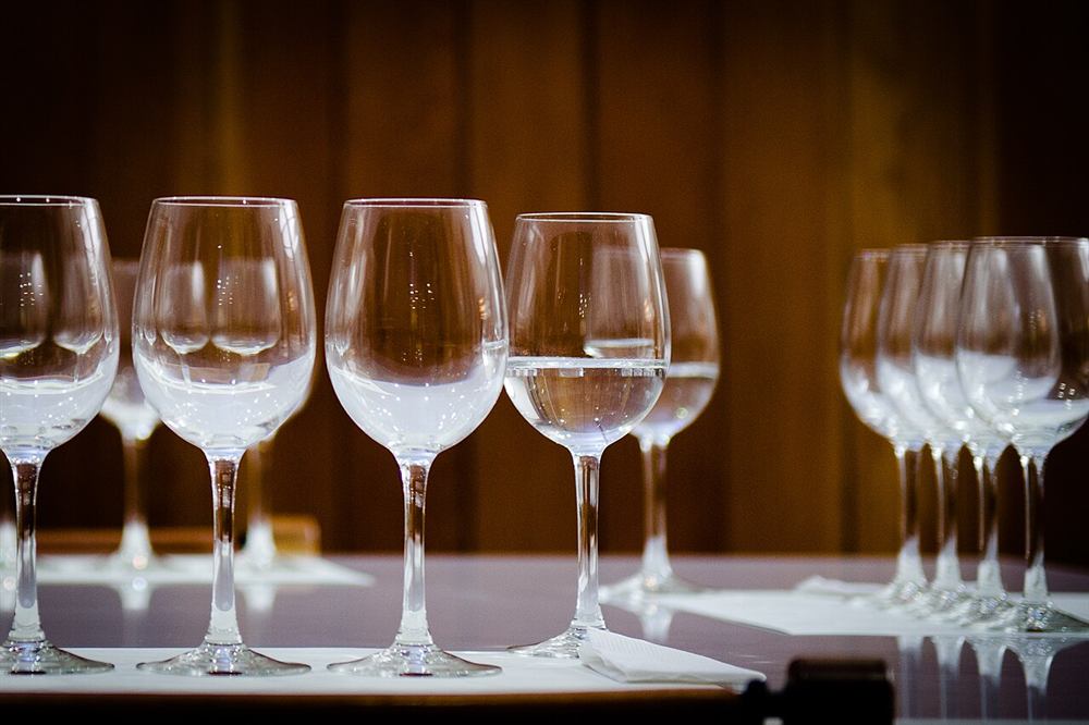 Tasting glasses set out on the table before a wine tasting