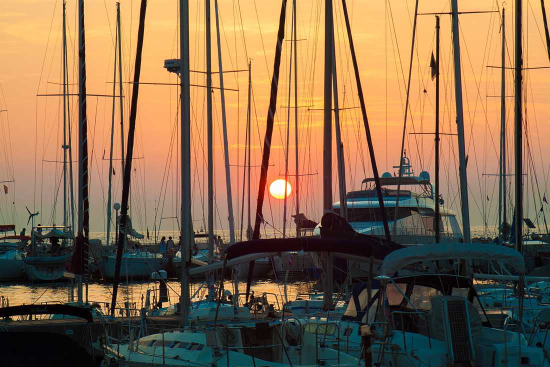 Sailing yachts at a Greek quay as the sun drops, the start of a Lefkada sunset cruise