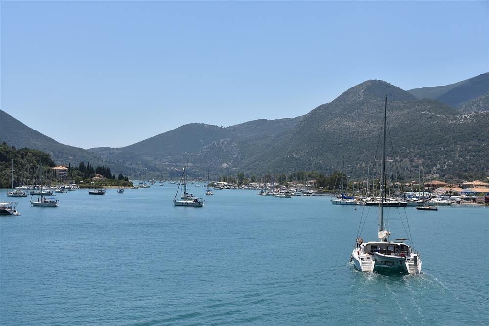 Sailing yachts and catamarans moored in the sheltered harbour of Nydri on Lefkada