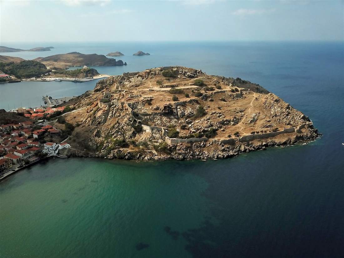 The fortified castle headland above the harbour and town of Myrina on Limnos, reached by airport transfers from Limnos Airport
