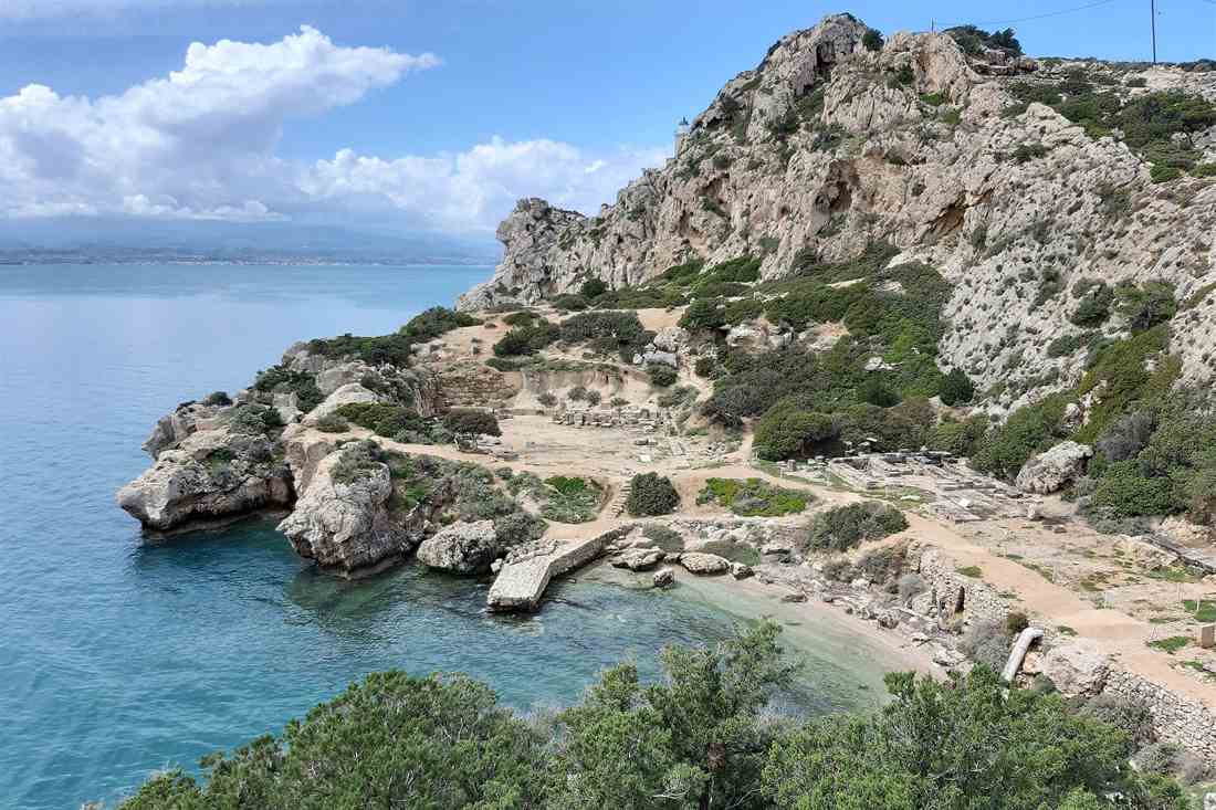 Turquoise cove of the Heraion of Perachora below the Melagavi lighthouse, a stop on the Loutraki kayak tour