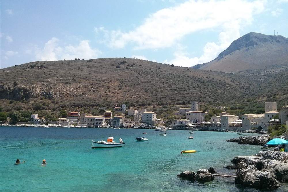 Stone tower houses at the turquoise bay of Limeni below Areopoli, Mani