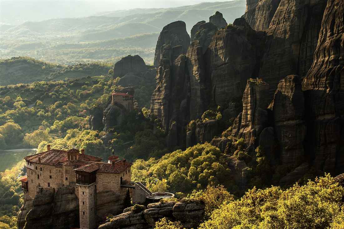 Roussanou monastery and the Meteora pillars in evening light on the e-bike route