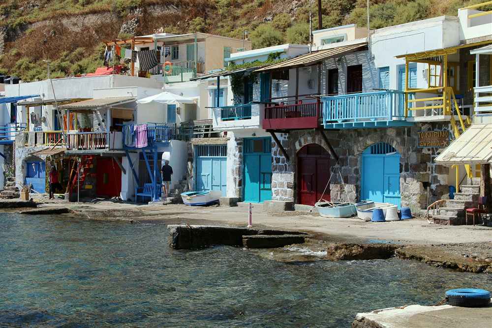 The painted syrmata boathouse doors of Klima on Milos