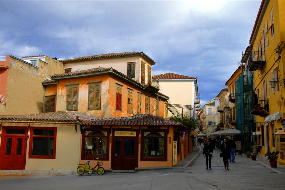 Walkers in an old town street in Nafplio