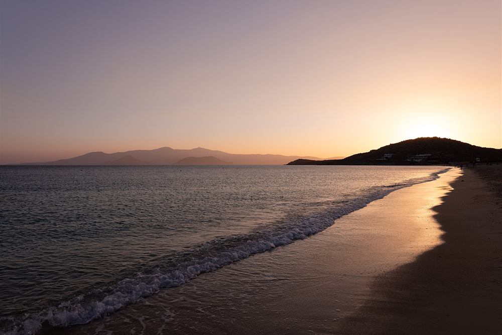 Naxos sunset cruise route along Agios Prokopios beach at sunset