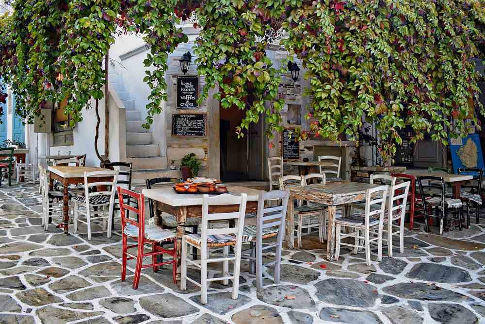 Taverna tables in the square of Halki village, Naxos tours