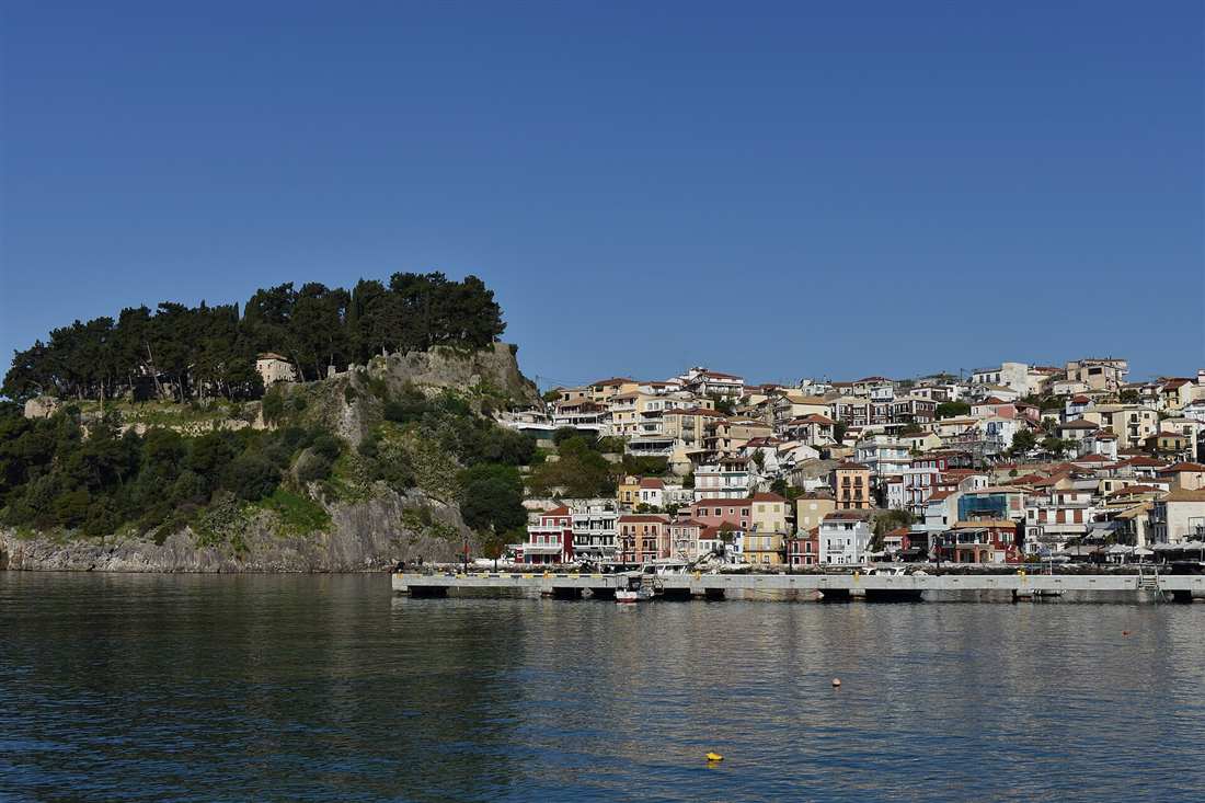 The town of Parga and its Venetian castle above the harbour seen from the water, the base for a Parga yacht charter