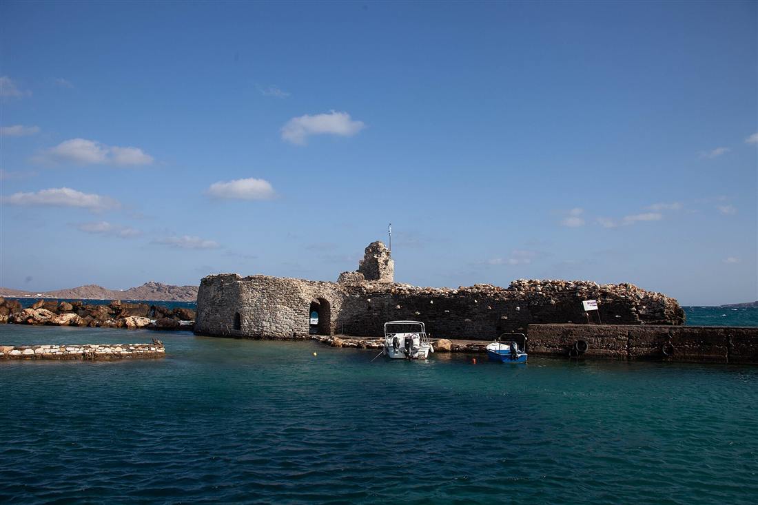 The Venetian castle at the harbour entrance of Naoussa on Paros, the island reached by airport transfers from Paros Airport