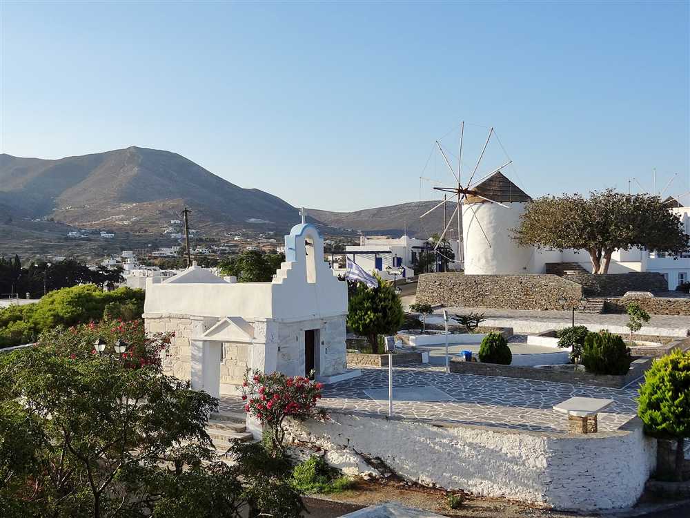 A whitewashed windmill and chapel at Parikia on Paros, Greece