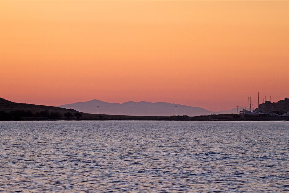 Leaving the harbour at Naoussa on Paros as the sky turns orange