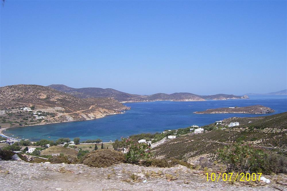 A turquoise cove on Patmos with a yacht anchored in the clear water