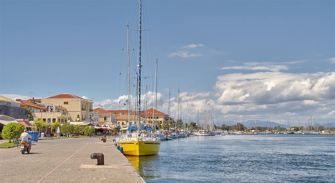 Sailing yachts moored along the sunlit Preveza waterfront on the Ionian, a base for a Preveza yacht charter