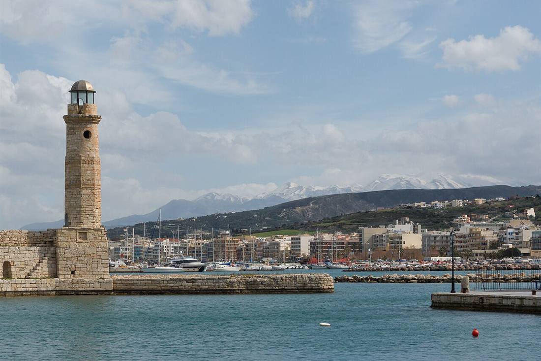 Rethymno harbour, the Venetian lighthouse and the marina below the White Mountains