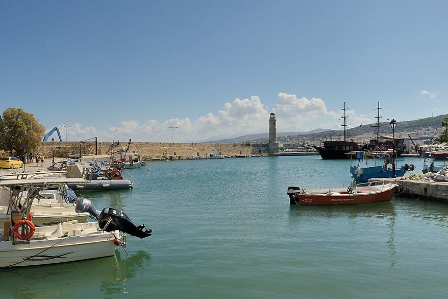 Small boats moored along the Venetian harbour quay at Rethymno on Crete