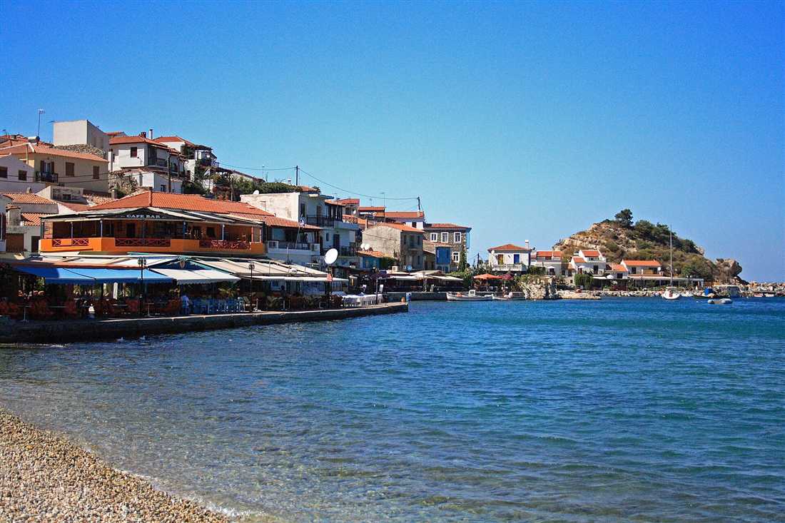 The red-roofed seaside village of Kokkari on Samos, the island reached by airport transfers from Samos Airport