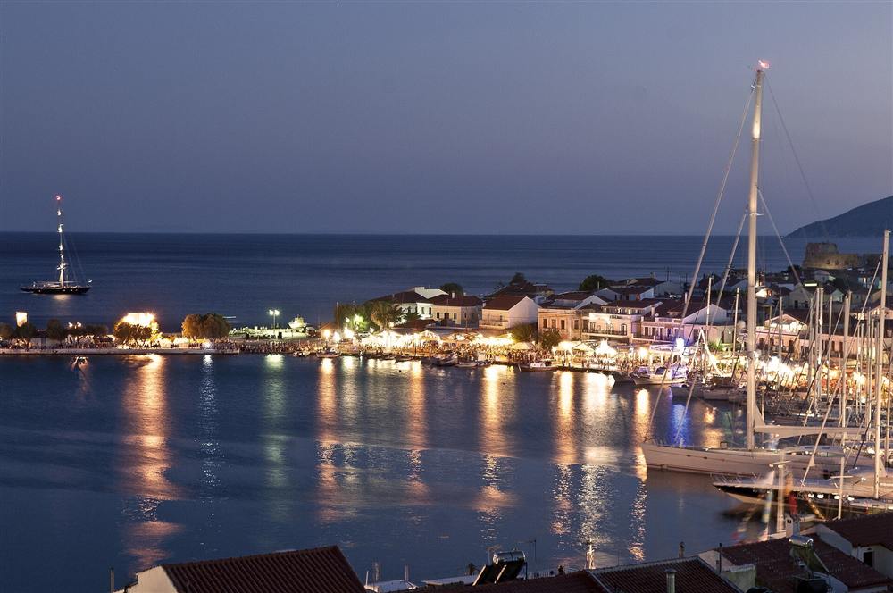 The lit harbour of Pythagoreio on Samos at dusk, Greece