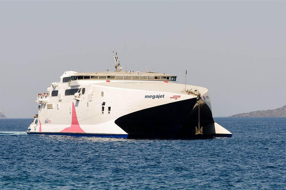 A SeaJets high-speed catamaran crossing the sea off Santorini