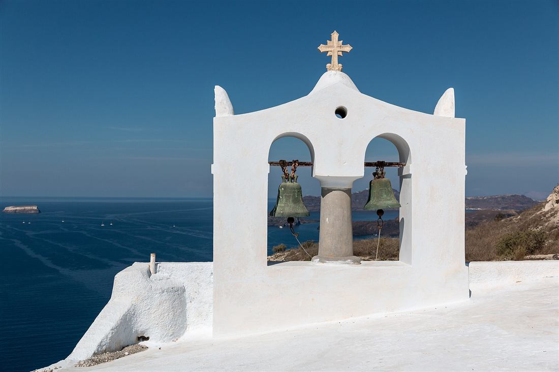 Bell tower in Megalochori above the Santorini caldera, a village on the Santorini e-bike tour