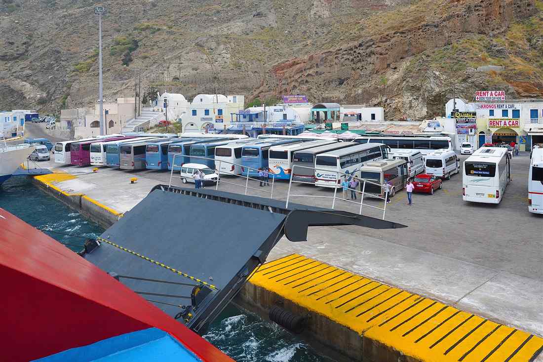 Coaches and transfer vehicles waiting at Athinios port, Santorini