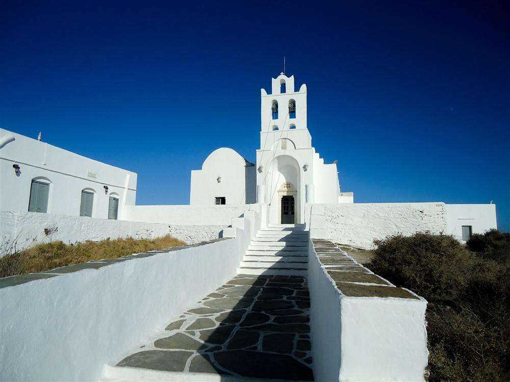 The whitewashed Chrysopigi monastery on its rock on the south coast of Sifnos
