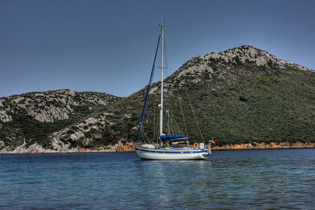 Sithonia sailing tour yacht at anchor inside Porto Koufo