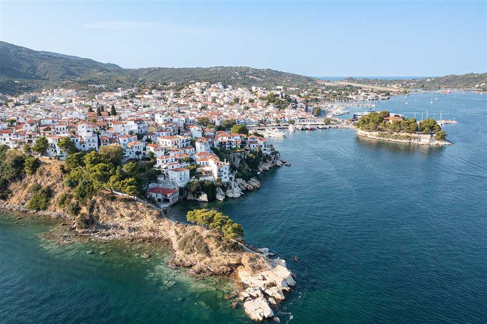 The whitewashed town and harbour of Skiathos seen from the air, Greece