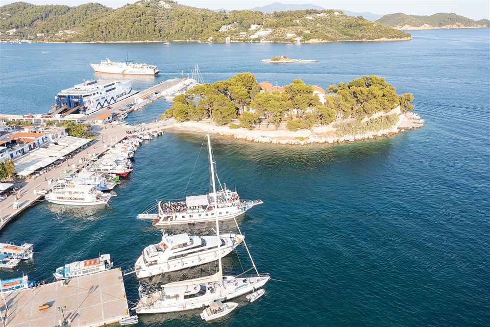 The Bourtzi headland and the Skiathos old port cruise fleet from the air