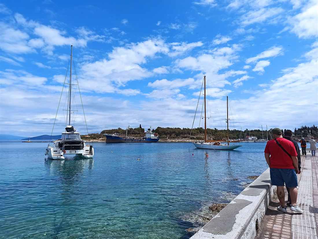 A catamaran and sailing yachts anchored off Spetses in the Saronic Gulf, a base for a Spetses yacht charter