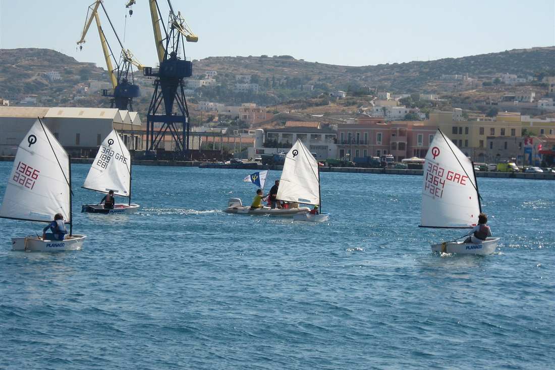 Boats under sail on the water off Syros