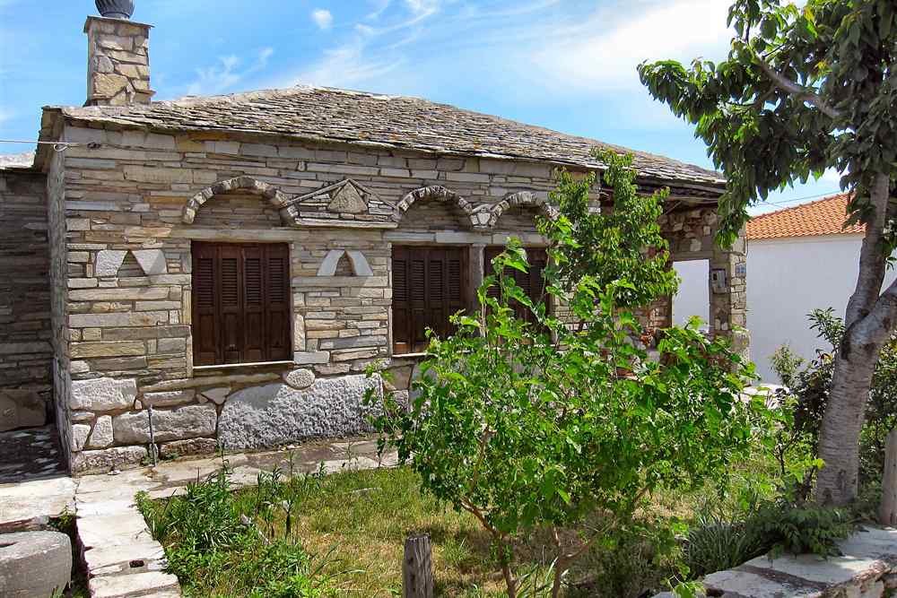A traditional stone house with a slate roof in the mountain village of Theologos, Thassos