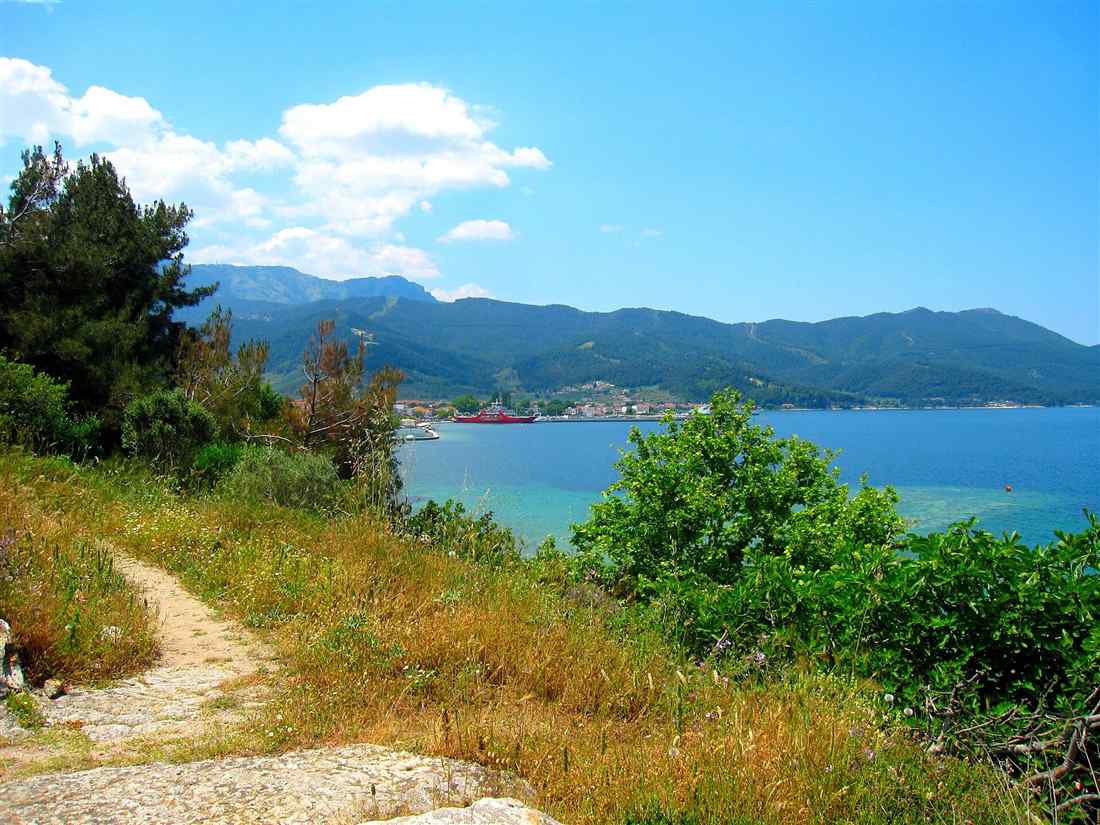 The sunlit turquoise bay and town of Thassos in the northern Thracian Sea, a base for a Thassos yacht charter