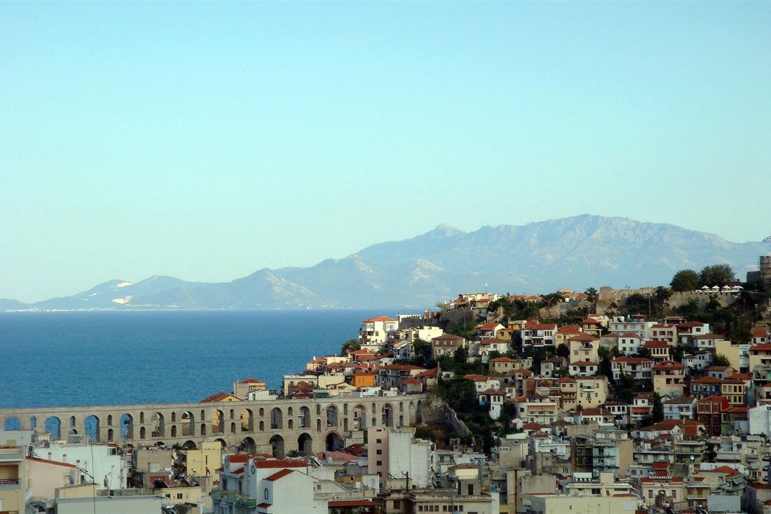 The Kamares aqueduct crossing Kavala with the Panagia old town climbing to the castle above the gulf