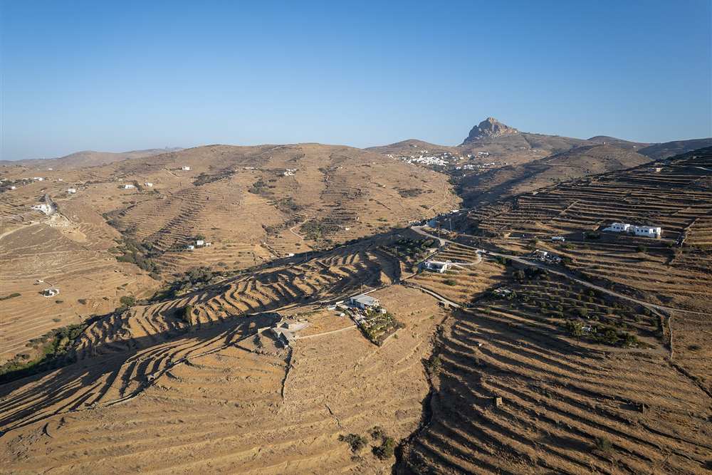 Farm terraces and village houses on Tinos seen from the air