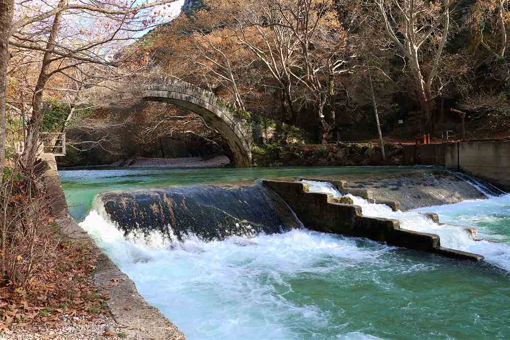 The old stone arch at Klidonia over the running Voidomatis, the takeout point of the raft run