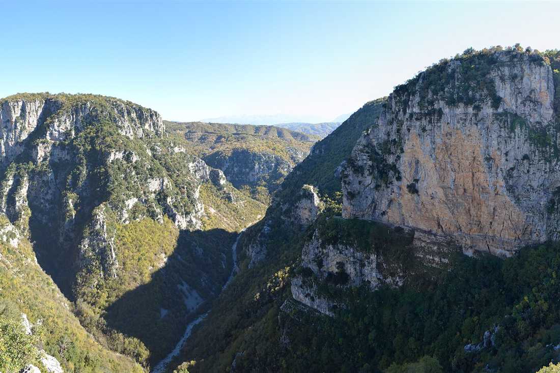 Zagori canyoning: the limestone walls of the Vikos gorge in Zagori, Epirus, with the river bed far below