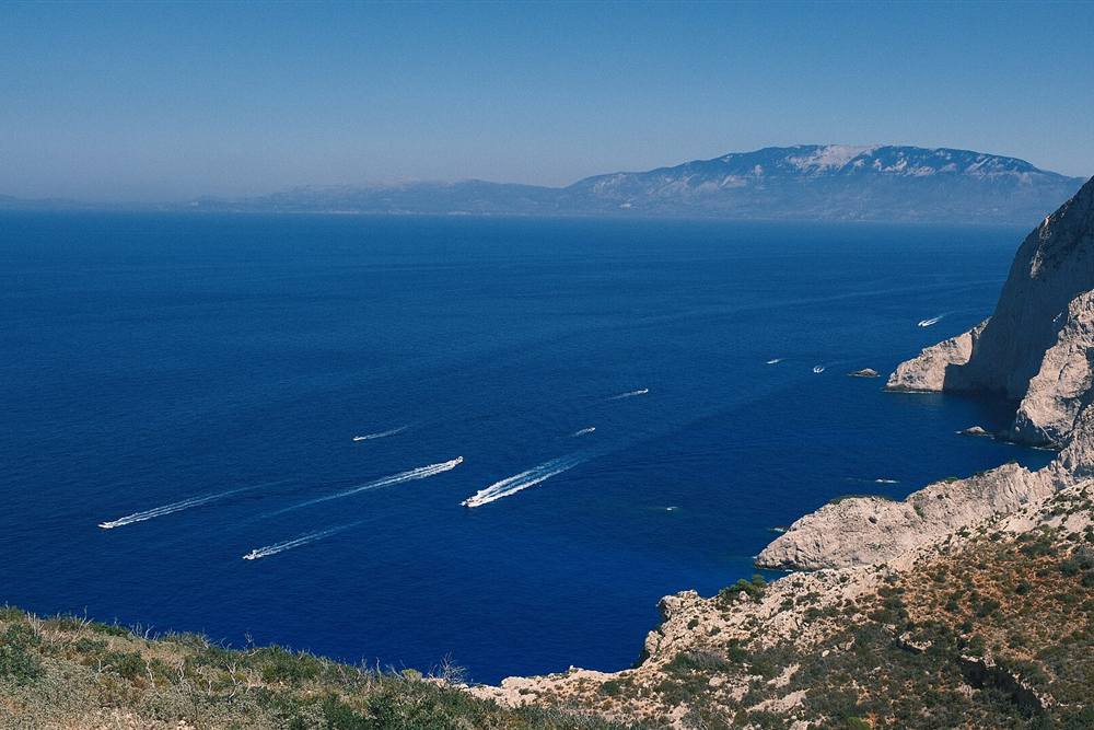Speedboats running the west coast of Zakynthos below the Keri cliffs