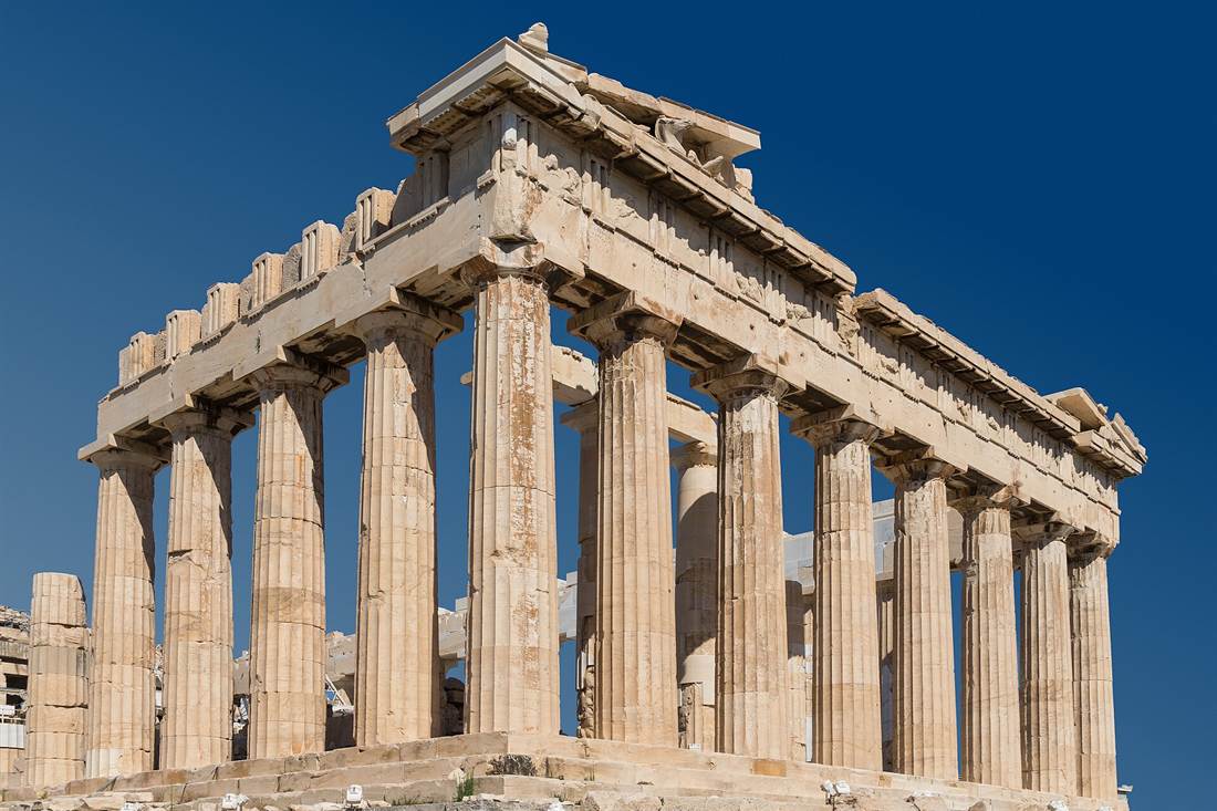 Parthenon on the Acropolis of Athens, seen from its east corner, with Doric columns against a clear blue sky