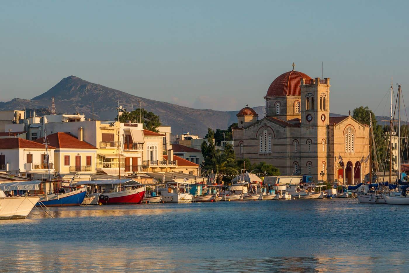 The harbour of Aegina Town with the church of Panagitsa, where Aegina port transfers meet ferry passengers