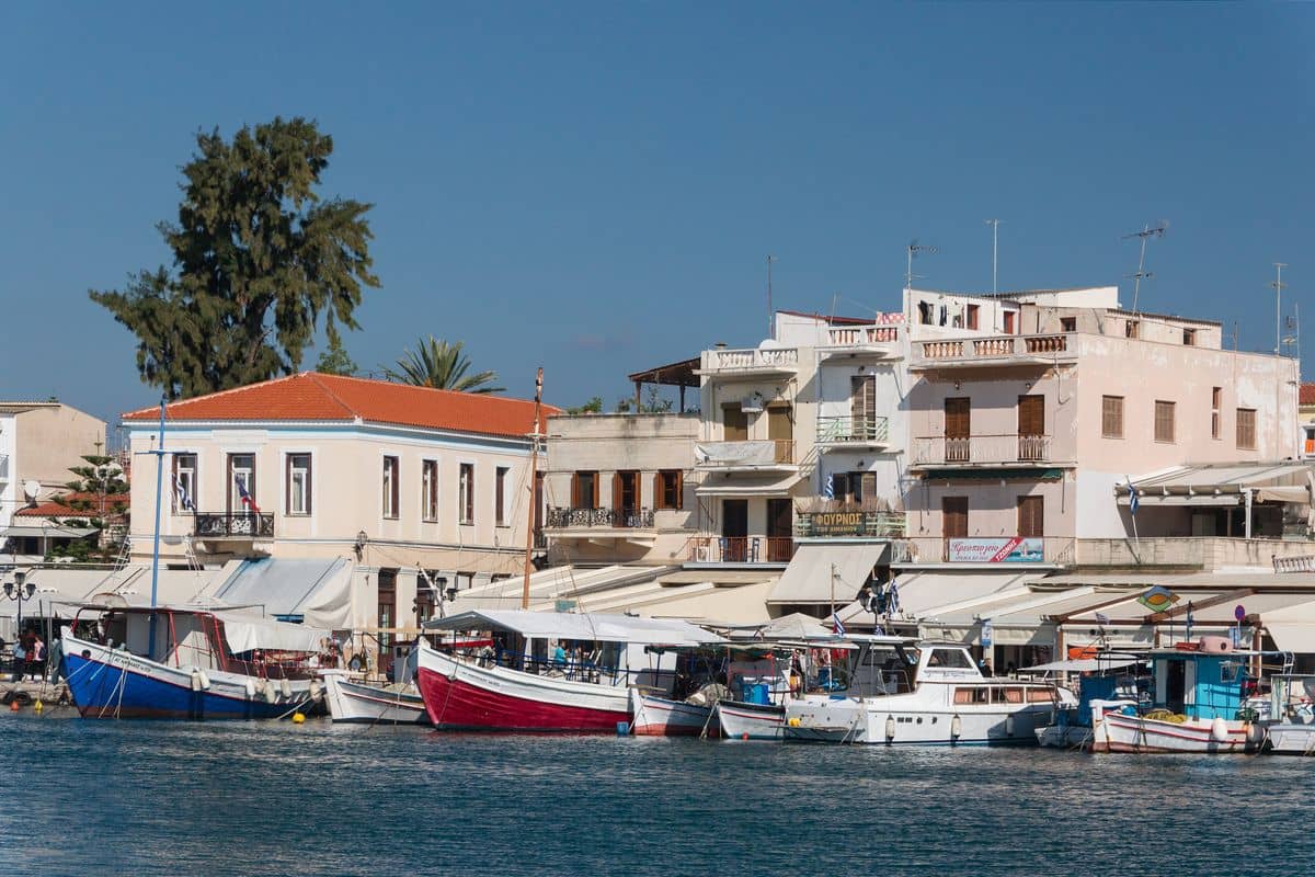 Fishing boats along the harbour front of Aegina Town, the pickup point for Aegina port transfers