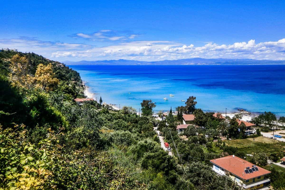Afytos tours look down from the village slope to the beach and the Toroneos Gulf