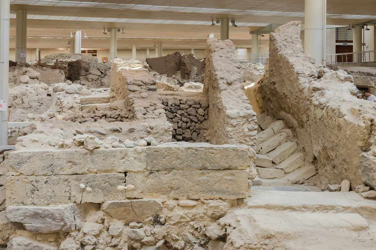 Stone walls and a staircase at Cenotaph Square, one of the stops covered by the guided tours and audio guides sold with Akrotiri tickets.