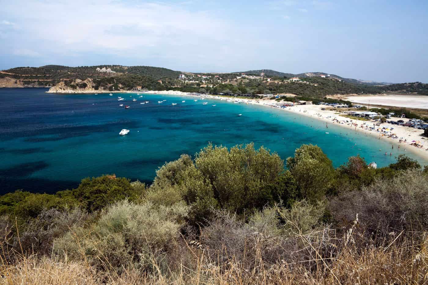 Ammouliani tours at the long sandy beach and turquoise bay of Ammouliani island