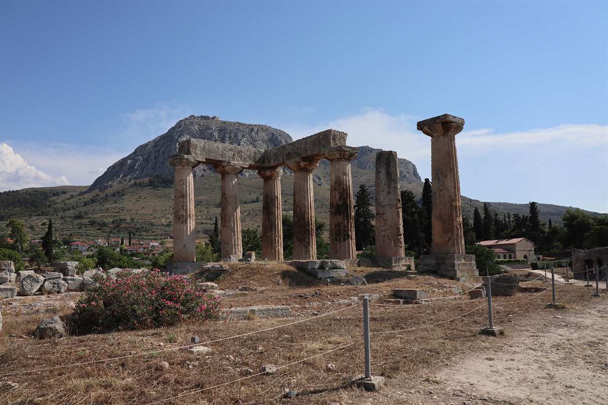 Ancient Corinth tickets cover the Temple of Apollo, whose seven Doric columns stand below the rock of Acrocorinth.